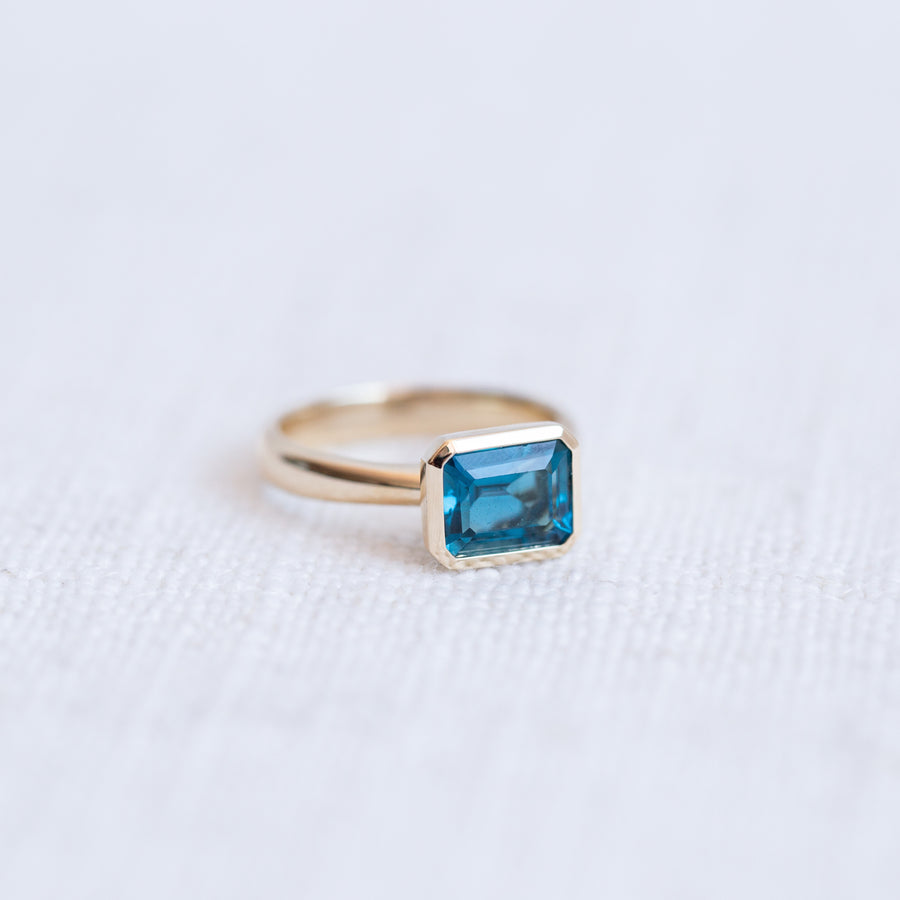 Limited Edition 9K Yellow Gold Emerald Cut London Blue Topaz Ring